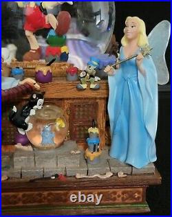 DISNEY Pinocchio & Snow White Share A Dream Come True Musical Snow Globe