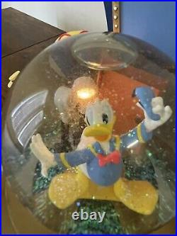 Disney Donald Duck Through the Years Moving Musical Snow Globe Battery Lights