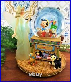 Disney Pinocchio Blue Fairy Snow Globe Musical Toyland Jiminy Cricket READ VIDEO