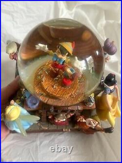 Disney Pinocchio Snow White Dwarfs Share a Dream Come True Musical Snow Globe