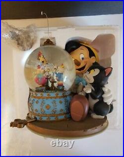 Rare Disney Pinocchio and Figaro Magic Musical Snow Globe Brahm's Waltz. NIB