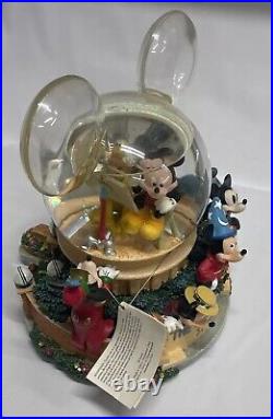 Walt Disney Studios Musical Snow Globe Mickey Mouse Through The Years. Lights